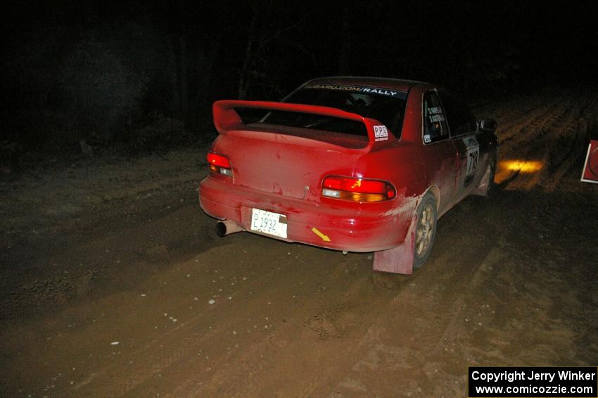 Dustin Kasten / Dave Parps blast away from the start of SS9, Menge Creek, in their Subaru Impreza.