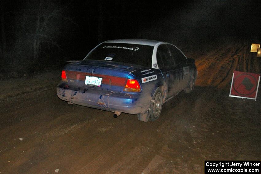 Mike Isaacs / Craig Walli blast their Saturn SL2 away from the start of SS9, Menge Creek.