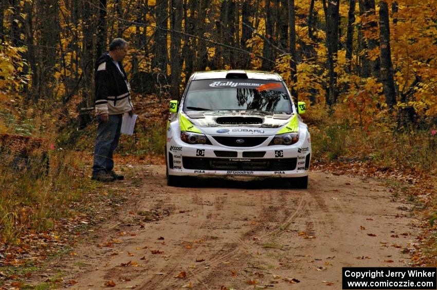 The Ken Block / Alex Gelsomino Subaru WRX STi checks into the finish of SS10, Gratiot Lake 1.