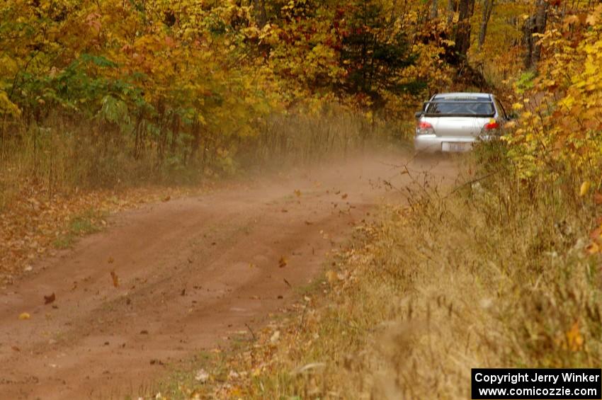 The Piotr Wiktorczyk / Alan Dolan Subaru WRX STi blasts into the finish of SS10, Gratiot Lake 1.