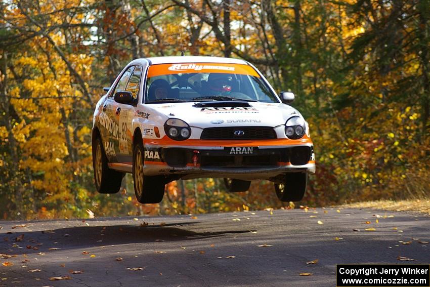 Pat Moro / Mike Rossey catch nice air at the midpoint jump on Brockway 1, SS13, in their Subaru WRX.