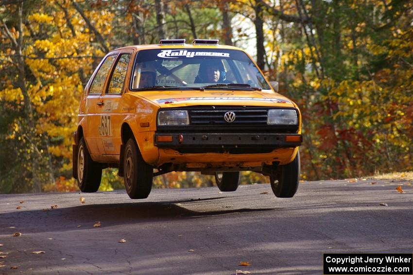 The VW Golf of Chad Eixenberger / Jay Luikart gets nice air at the midpoint jump on Brockway 1, SS13.