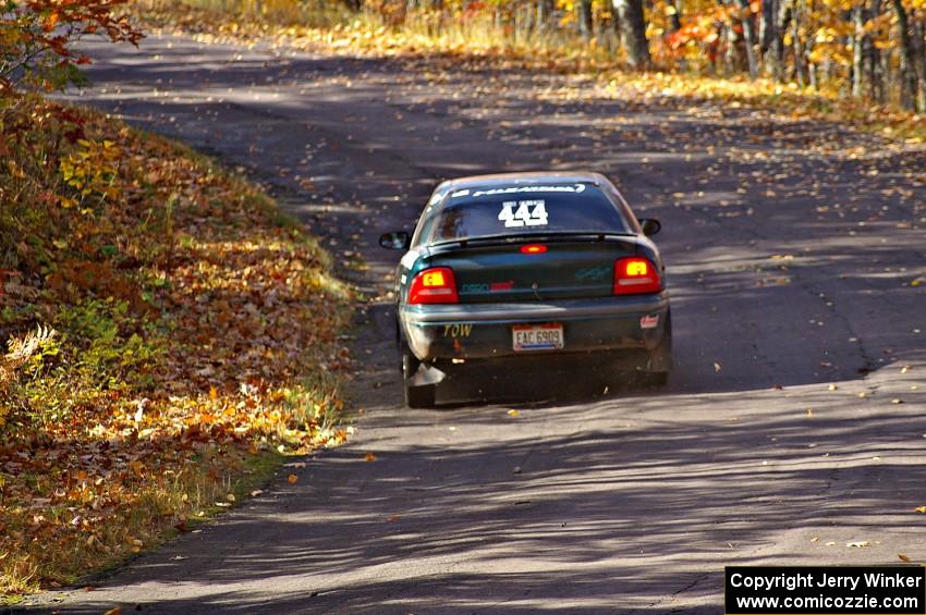 Chris Greenhouse / Don DeRose take it easy up the hill in their Neon just after the midpoint jump on Brockway 1, SS13.