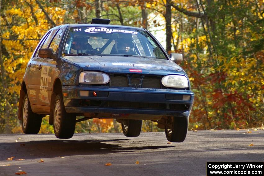 Paul Koll / Carl Seidel catch air at the midpoint jump on Brockway 1, SS13, in their VW Golf.