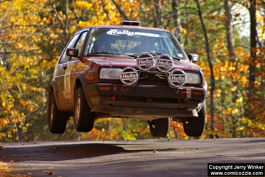 Billy Mann / Josh VanDenHeuvel catch nice air at the midpoint jump on Brockway 1, SS13, in their VW GTI.