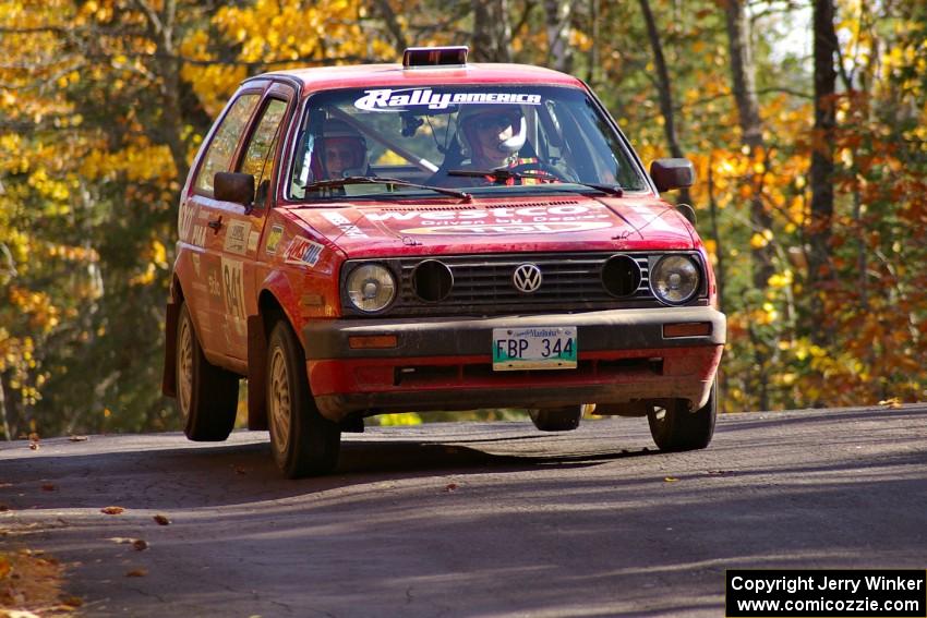 Daryn Chernick / Heidi Nunnemacher get the back-end light at the midpoint jump on Brockway 1, SS13, in their VW GTI.