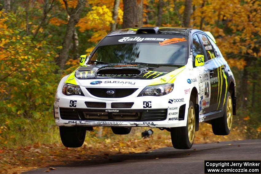 Ken Block / Alex Gelsomino catch decent air at the midpoint on Brockway 2, SS14, in their Subaru WRX STi.