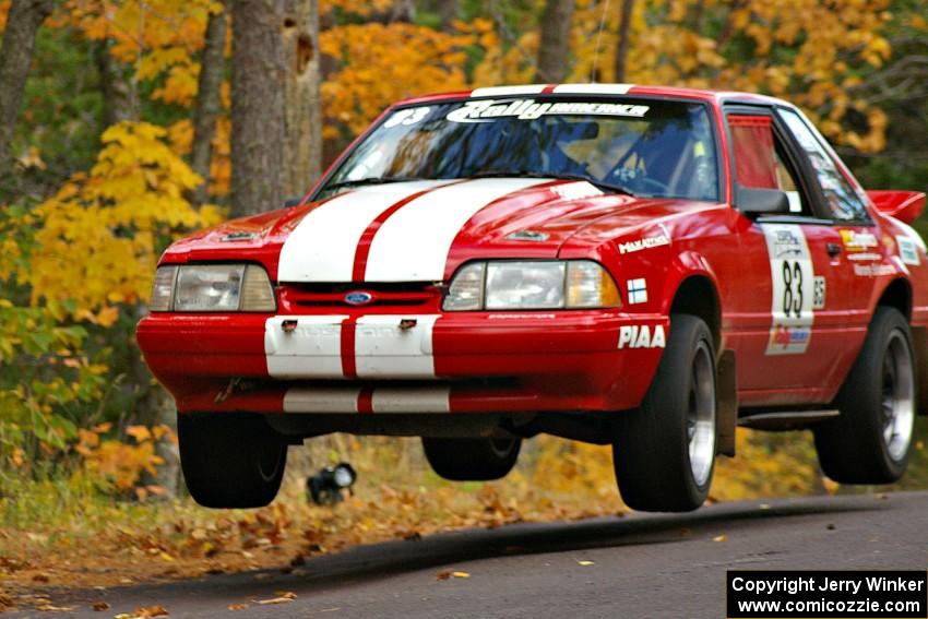 Mark Utecht / Rob Bohn catch decent air at the Brockway 2, SS14, midpoint jump in their Ford Mustang.