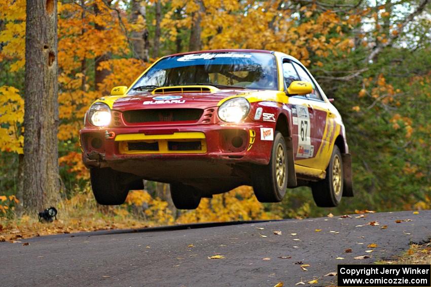 Bryan Pepp / Jerry Stang get their Subaru WRX nicely airborn at the midpoint jump on Brockway 2, SS14.