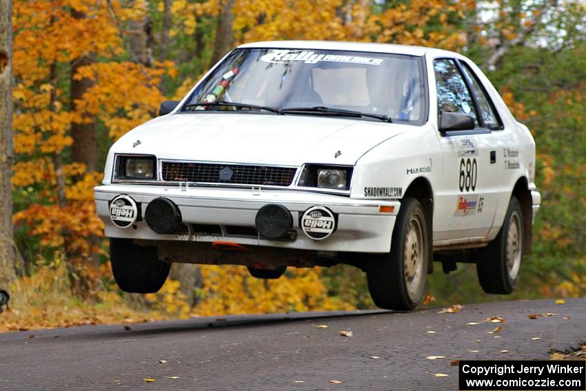 Greg Woodside / Tom Woodside catch nice air at the midpoint jump on Brockway 2, SS14, in their Dodge Shadow.