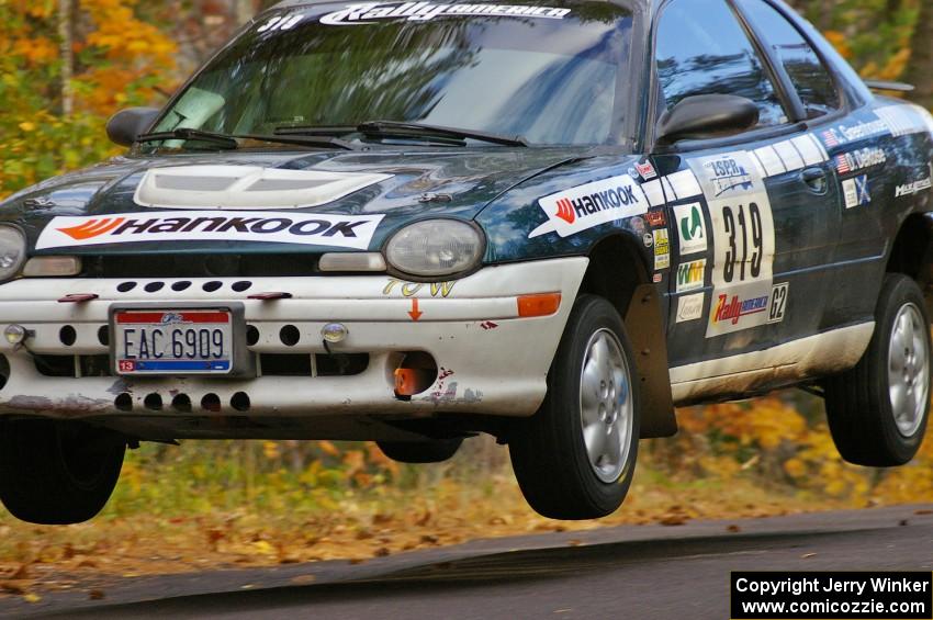 Chris Greenhouse / Don DeRose get nice air in their Plymouth Neon at the midpoint jump on Brockway 2, SS14.