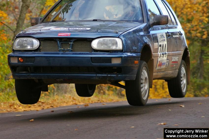 Paul Koll / Carl Seidel catch decent air at the midpoint jump on SS14, Brockway 2, in their VW Golf.