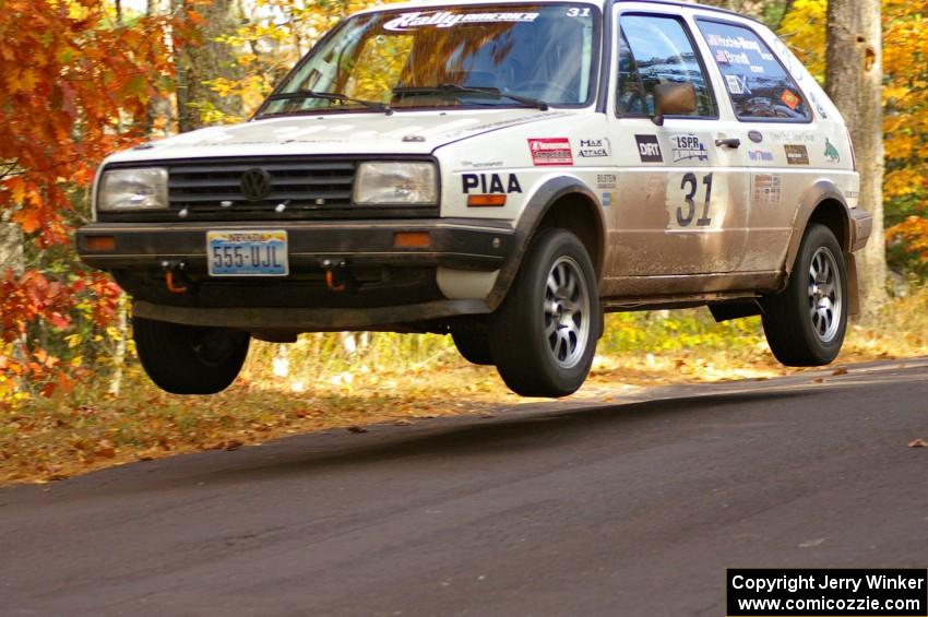 Michel Hoche-Mong / Jimmy Brandt catch major air at the midpoint jump on Brockway 2, SS14, in their VW GTI.