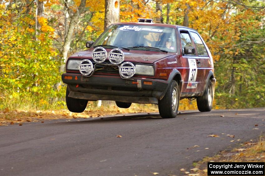 Billy Mann / Josh VanDenHeuvel come down on the left-hand side after the midpoint jump on Brockway 2, SS14, in their VW GTI.