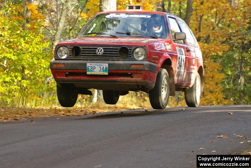 Daryn Chernick / Heidi Nunnemacher catch a bit of air at the midpoint jump on Brockway 2, SS14, in their VW GTI.