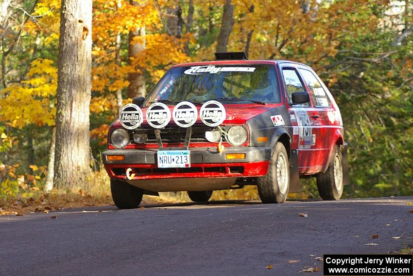 John Kimmes / Paul Peters take it easy at the midpoint jump on SS14, Brockway 2, in their VW GTI.