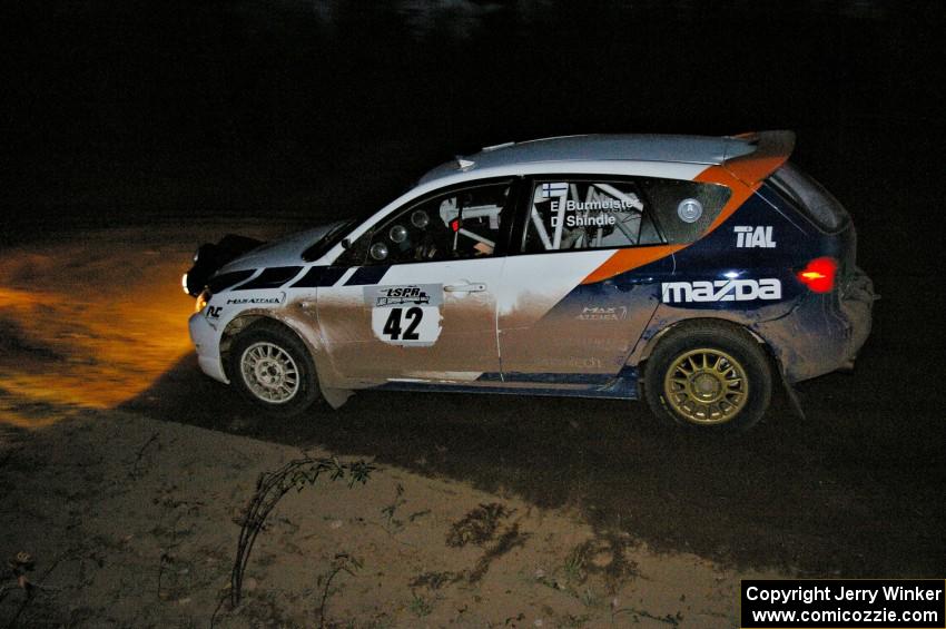 Eric Burmeister / Dave Shindle drift through the final corner of Gratiot Lake 2, SS17, in their Mazda Speed 3.