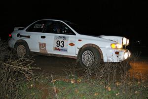 The Bob Olson / Conrad Ketelsen Subaru 2.5 RS drifts through a 90-right at the spectator point on SS7.