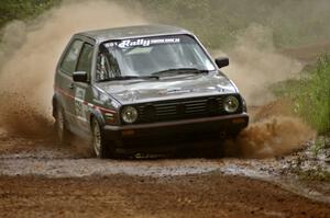 Dave Cizmas / Matt Himes drift their VW GTI through a dusty sweeper on SS1.