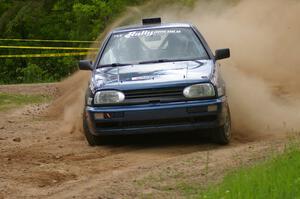 Paul Koll / Tim Knorr drift their VW Golf onto Potlatch Rd. on SS1.