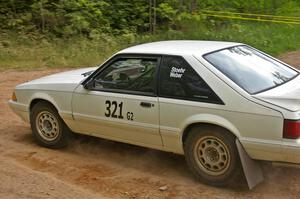 Bonnie Stoehr / Jake Weber take the left onto Potlatch Rd. on SS1 in their Ford Mustang.