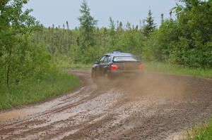 Carl Siegler / David Goodman drift hard through a left-sweeper on SS4 in their Subaru WRX STi.