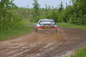 Mason Moyle / Scott Putnam drift their Subaru Impreza through a left-sweeper on SS4.
