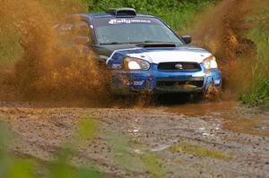 Slawomir Balda / Piotr Boczek hit a large puddle on SS5 squarely in their Subaru WRX.