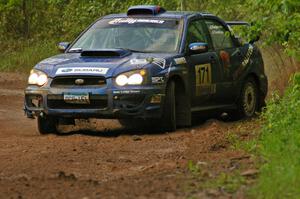 Carl Siegler / David Goodman take it to the edge of the sloppy road on SS6 in their Subaru WRX STi.