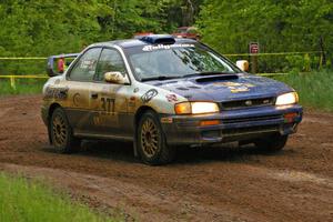 Mason Moyle / Scott Putnam drift their Subaru Impreza past spectators on SS6.