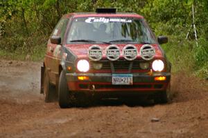 John Kimmes / Greg Smith drive through a very slippery right-hander on SS6 in their VW GTI.