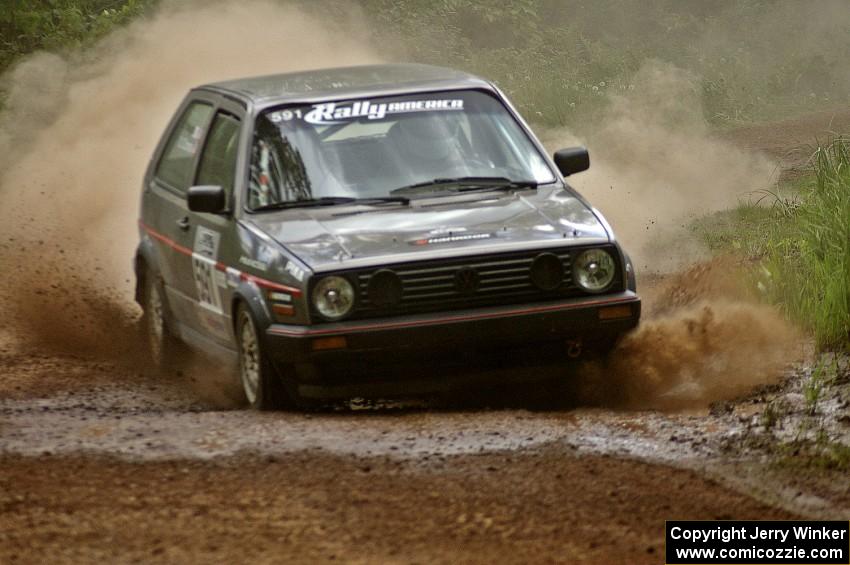 Dave Cizmas / Matt Himes drift their VW GTI through a dusty sweeper on SS1.