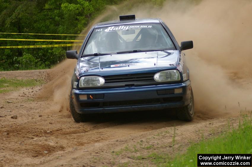 Paul Koll / Tim Knorr drift their VW Golf onto Potlatch Rd. on SS1.