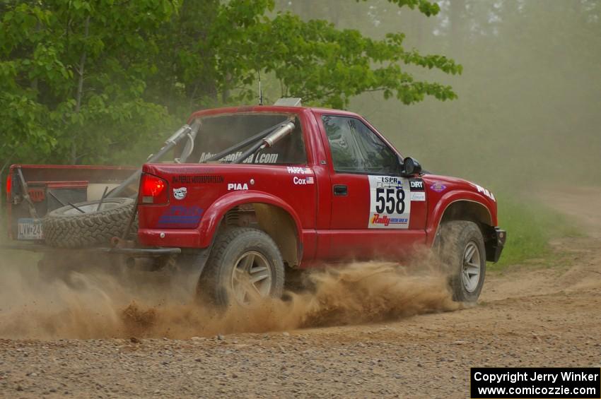 Jim Cox / Dave Parps drift their Chevy S-10 onto Potlatch Rd. on SS1.