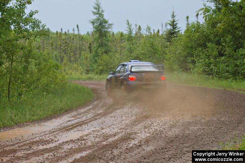 Carl Siegler / David Goodman drift hard through a left-sweeper on SS4 in their Subaru WRX STi.