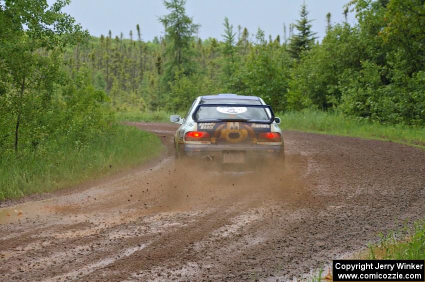 Mason Moyle / Scott Putnam drift their Subaru Impreza through a left-sweeper on SS4.