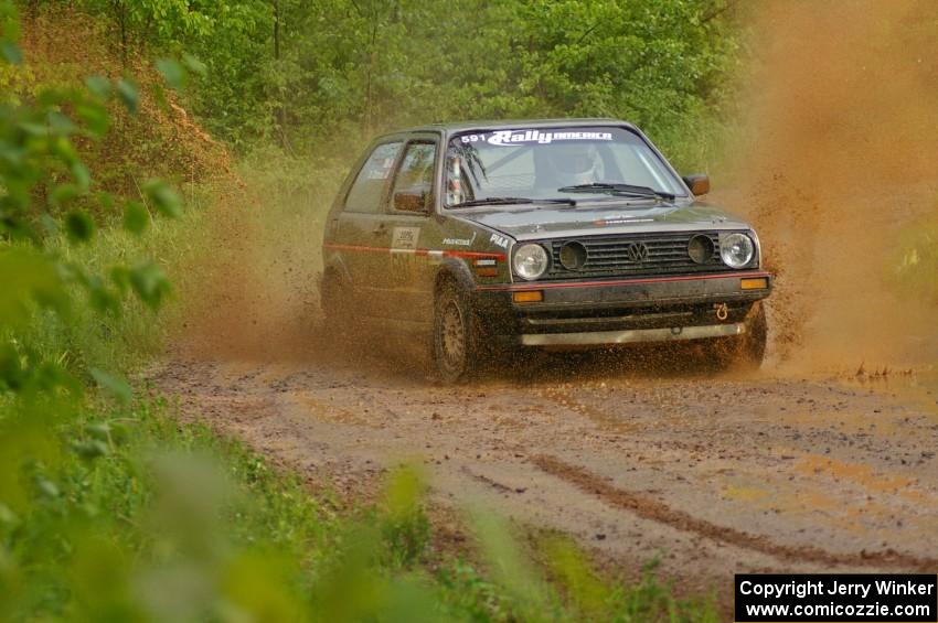 Dave Cizmas / Matt Himes hit a large puddle on SS5 in their VW GTI.