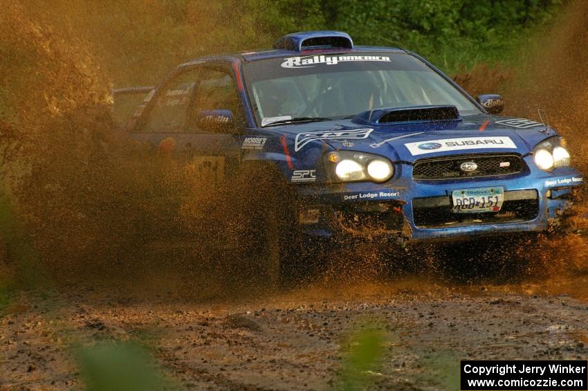 Carl Siegler / David Goodman hit a puddle on SS5 hard in their Subaru WRX STi.