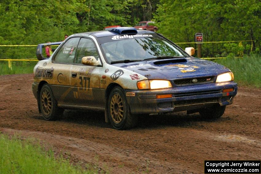 Mason Moyle / Scott Putnam drift their Subaru Impreza past spectators on SS6.