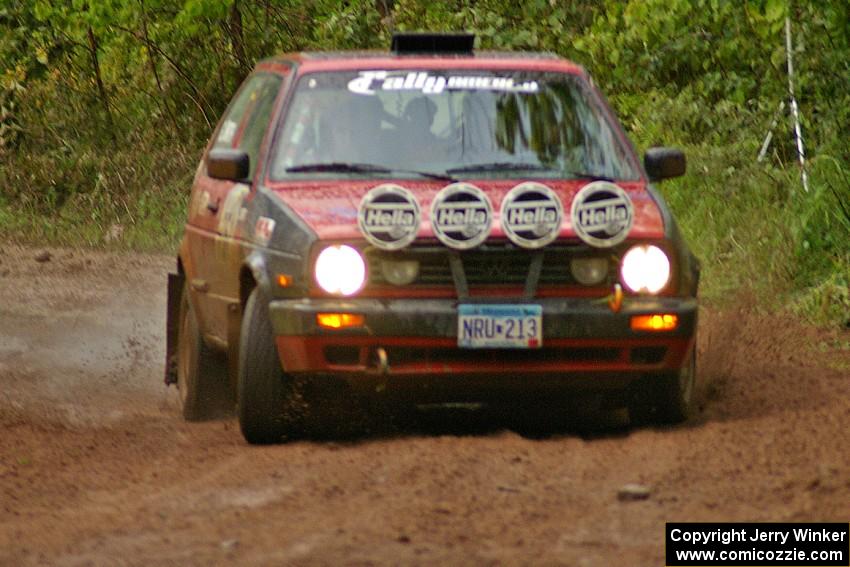 John Kimmes / Greg Smith drive through a very slippery right-hander on SS6 in their VW GTI.