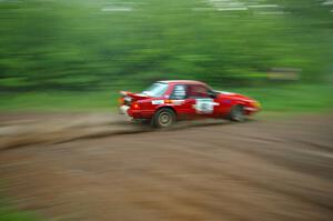 Mark Utecht / Rob Bohn drift their Ford Mustang through a sweeper in the absolute pouring rain on SS2.