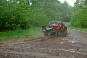 Jim Cox / Dave Parps slop through the pouring rain in their Chevy S-10 on SS2.
