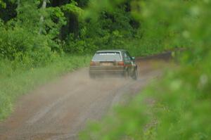 Dave Cizmas / Matt Himes drift their VW GTI into a sweeper on SS3 during a heavy rainfall.