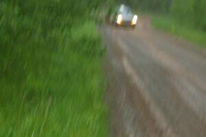 The Jim Scray / Colin Vickman Datsun 510 at speed during the driving rain on SS3.
