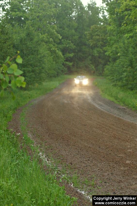 Mason Moyle / Scott Putnam at speed on a very sloppy straight on SS3 in their Subaru Impreza.