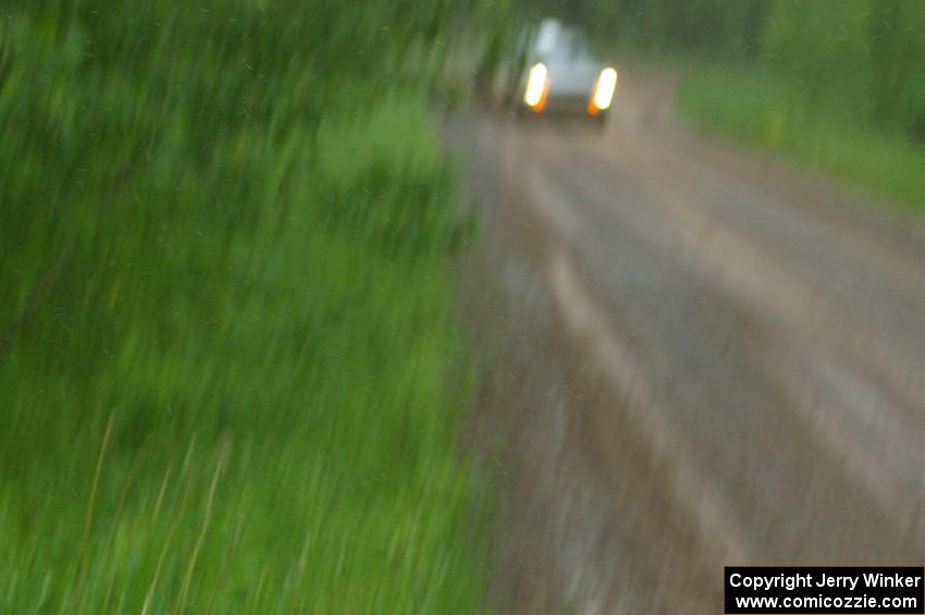 The Jim Scray / Colin Vickman Datsun 510 at speed during the driving rain on SS3.