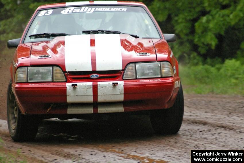 Mark Utecht / Rob Bohn drift their Ford Mustang through a sweeper on SS4.