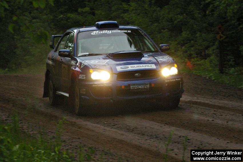 Carl Siegler / David Goodman at speed in the rain on SS4 in their Subaru WRX STi.