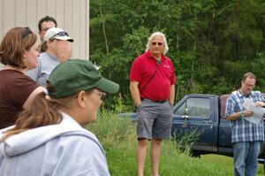 Kathy Freund expains things at the drivers meeting as Al Kintigh and Rob Bohn listen in.