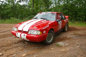 Mark Utecht / Rob Bohn make the hard left onto Potlatch Road on SS1 in their Ford Mustang.